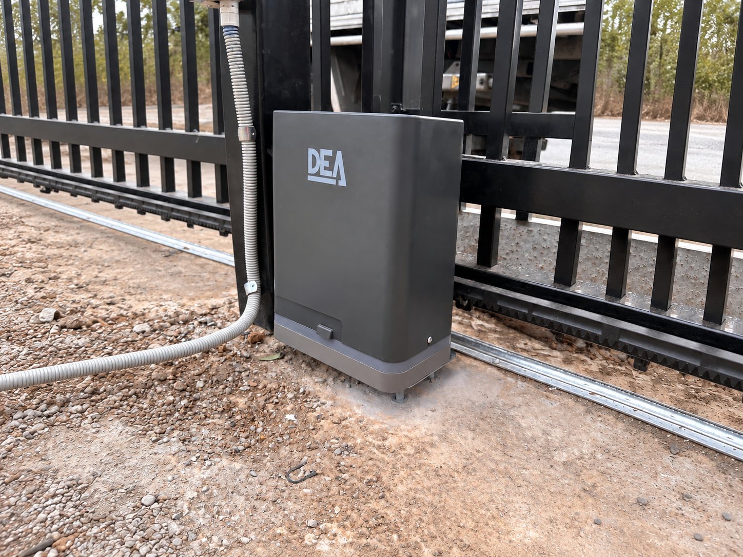 DEA sliding-gate motor beside the gate track